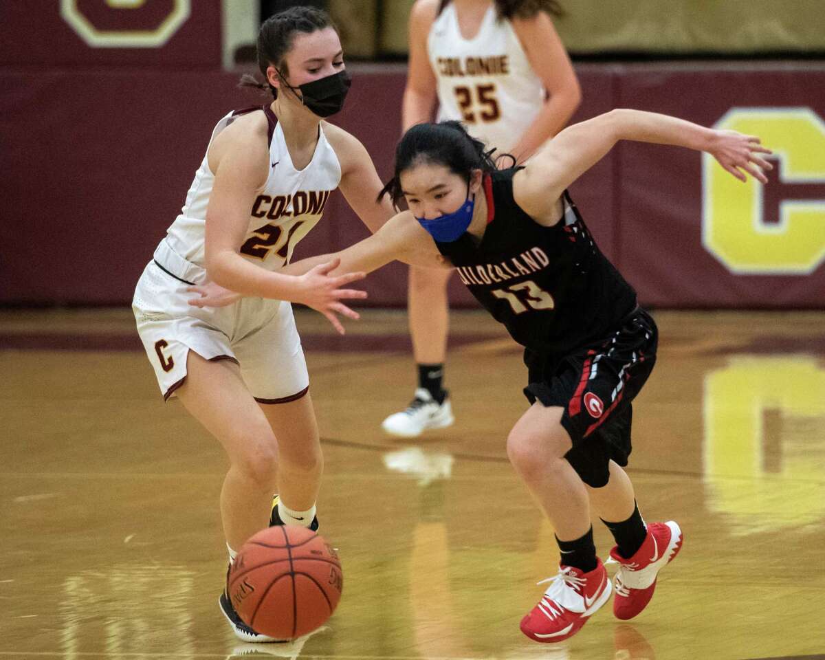 Guilderland senior Grace McFerran and Colonie guard Ava Pearson chase after a loose ball during a Suburban Council matchup at Colonie High School in Colonie, NY, on Saturday, Feb. 20, 2021 (Jim Franco/special to the Times Union.)