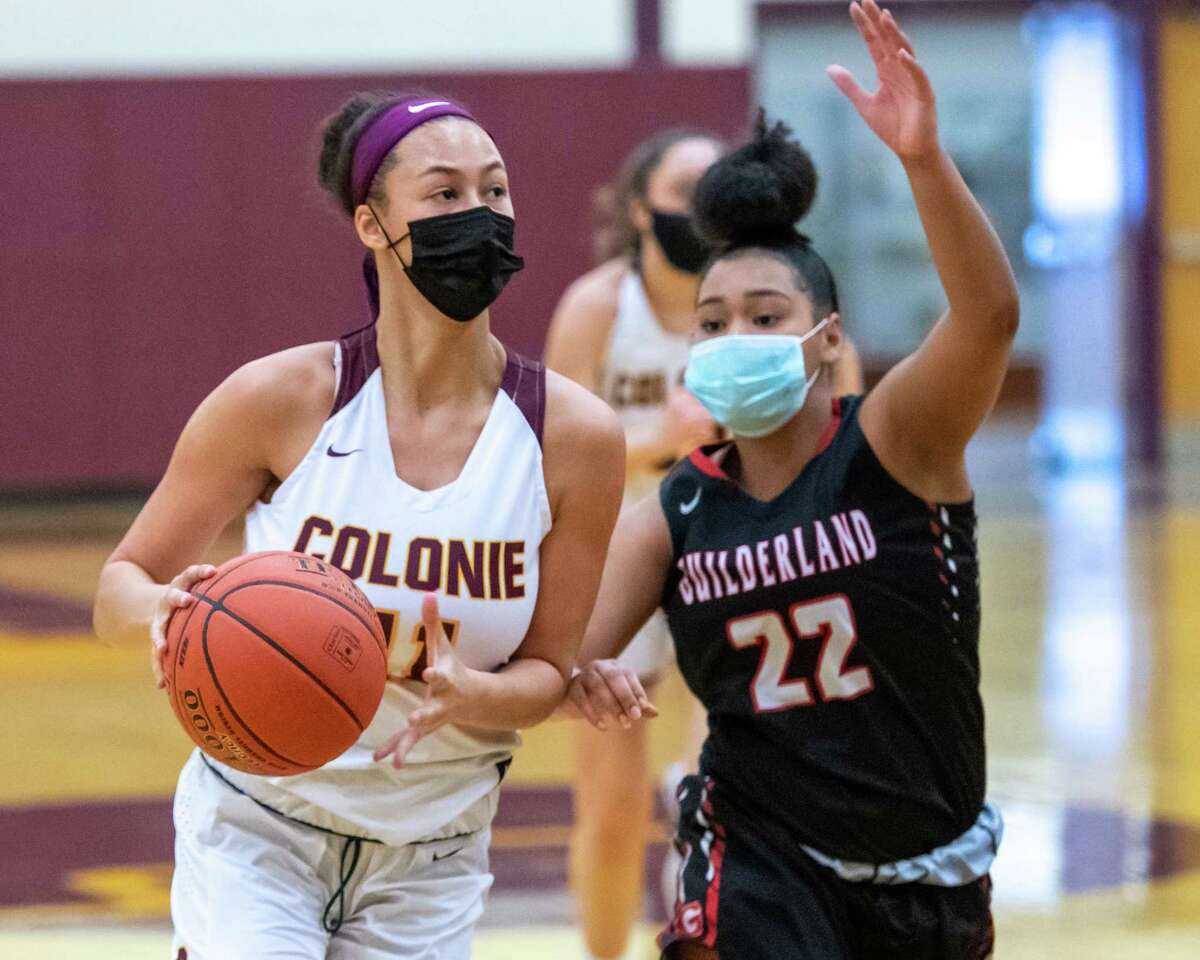 Colonie forward Jayla Tyler drives to the basket in front of Guilderland sophomore Destiny Pipino during a Suburban Council matchup against Colonie at Colonie High School in Colonie, NY, on Saturday, Feb. 20, 2021 (Jim Franco/special to the Times Union.)