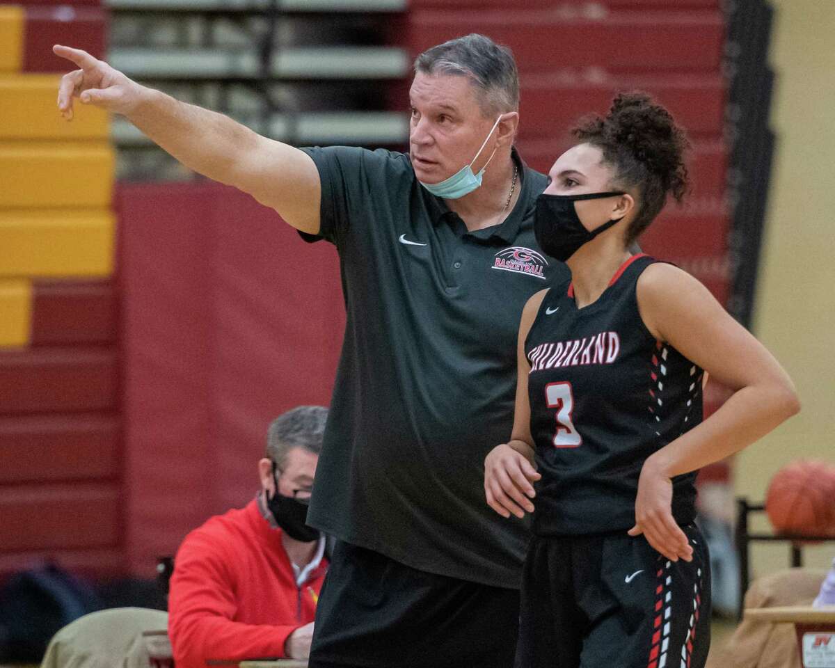 Guilderland head girls basketball coach Chuck Mack talks to senior Valencia Fontenelle Posson during a Suburban Council matchup against Colonie at Colonie High School in Colonie, NY, on Saturday, Feb. 20, 2021 (Jim Franco/special to the Times Union.)