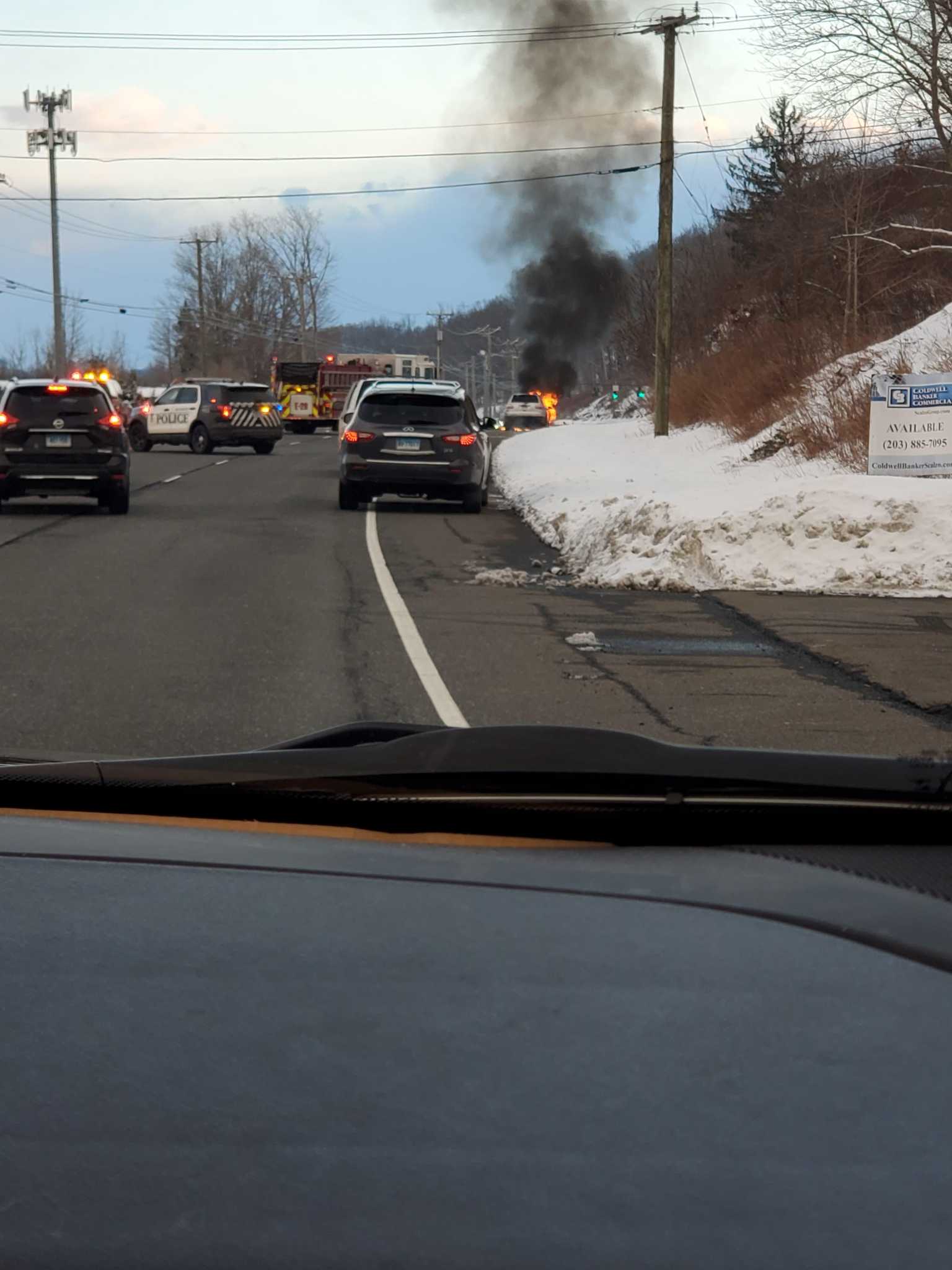 Firefighters put out 'fully involved' car fire near DanburyRidgefield line