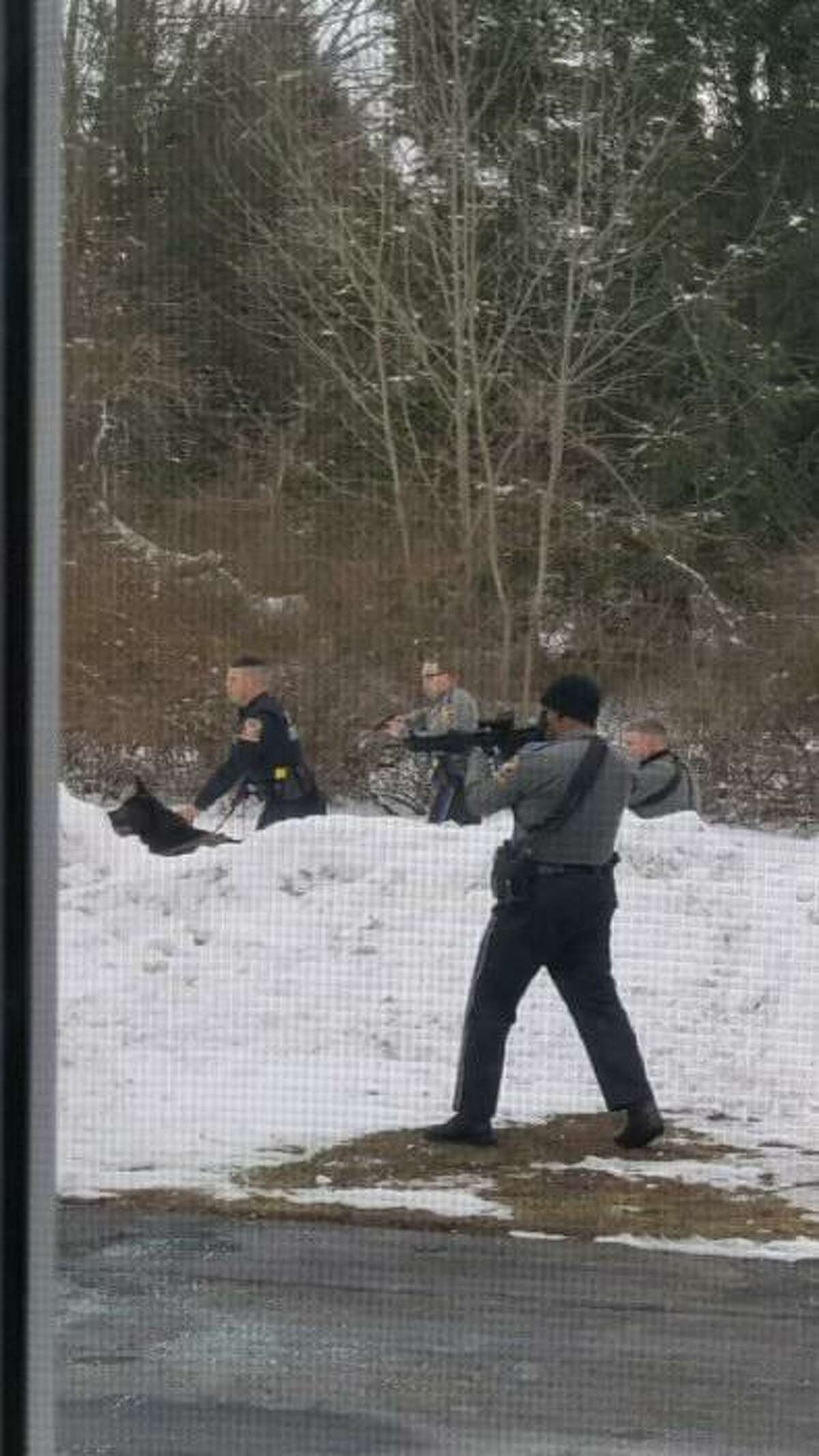 TOLLAND, Conn. — Resident Lance Shackway captured these photos as state police took several suspects into custody during an incident around 3 p.m. Saturday, Feb. 20. State police said a Trooper was hospitalized after a cruiser was intentionally struck by one of the suspects.