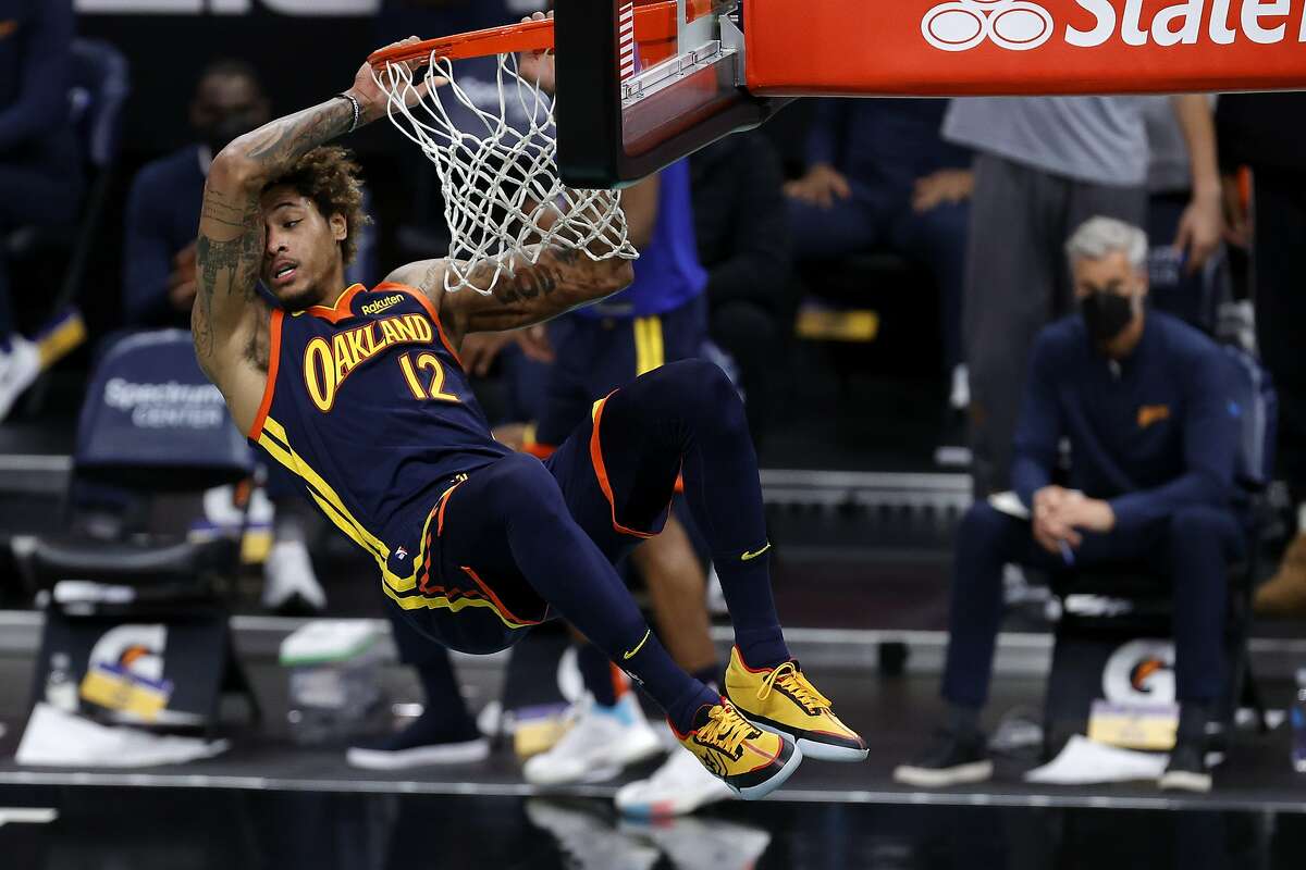 Kelly Oubre Jr. of the Golden State Warriors dunks the ball during the second quarter of their game against the Charlotte Hornets at Spectrum Center on February 20, 2021 in Charlotte, North Carolina.
