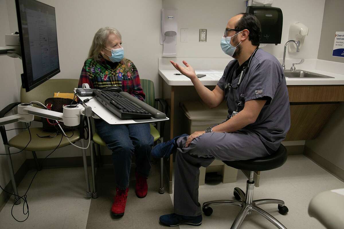 UT Health San Antonio’s Dr. Diego Maselli talks with asthma patient Diane Hearn. “The anguish of air hunger,” he said, “has been described as one of the worst feelings you can have.”