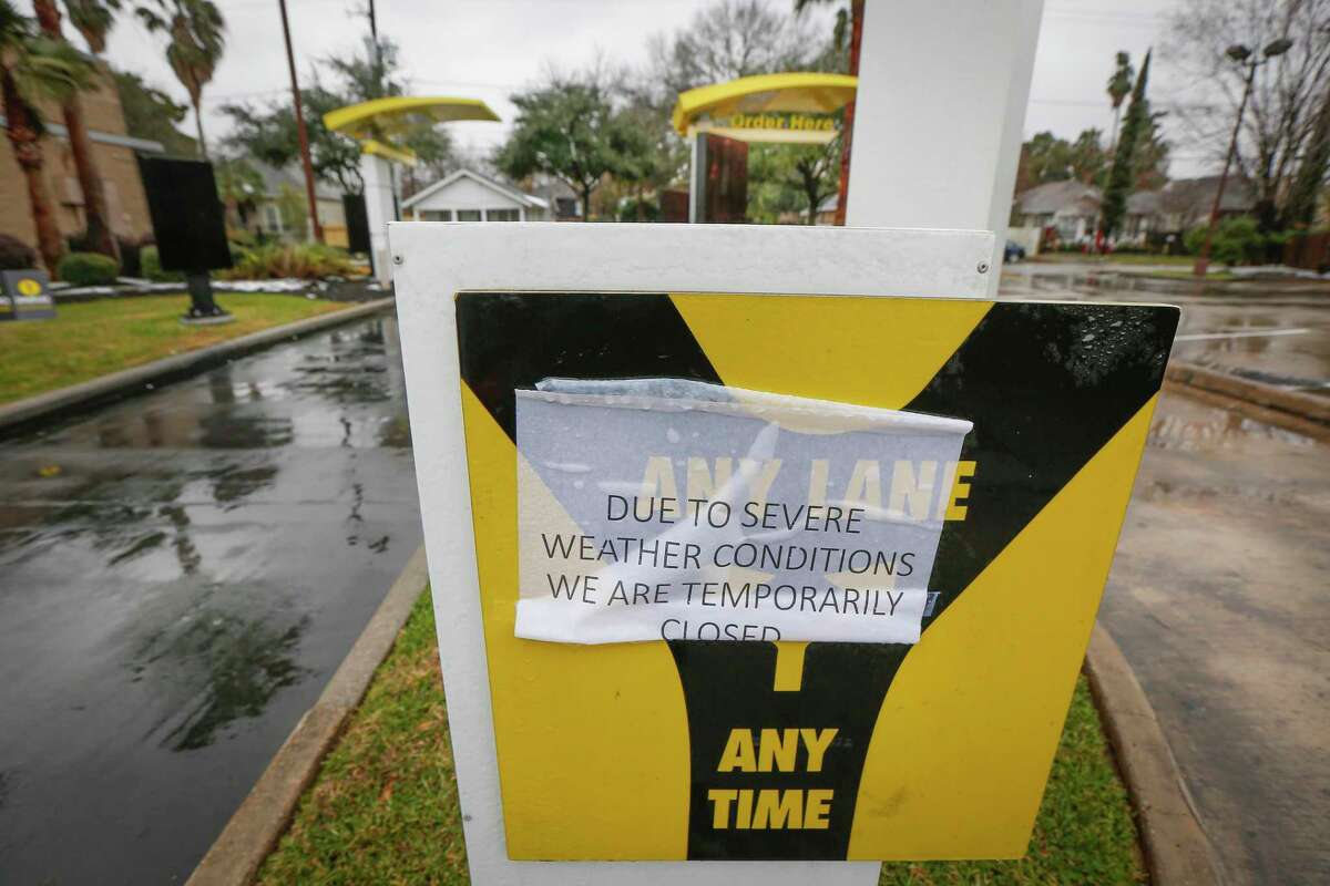 A McDonalds is closed at 3611 N Main St due to severe weather Wednesday, Feb. 17, 2021, in Houston. The winter storm will likely cost the country $50 billion in damage and economic loss, but the brunt of the economic impact will be felt by hourly workers.