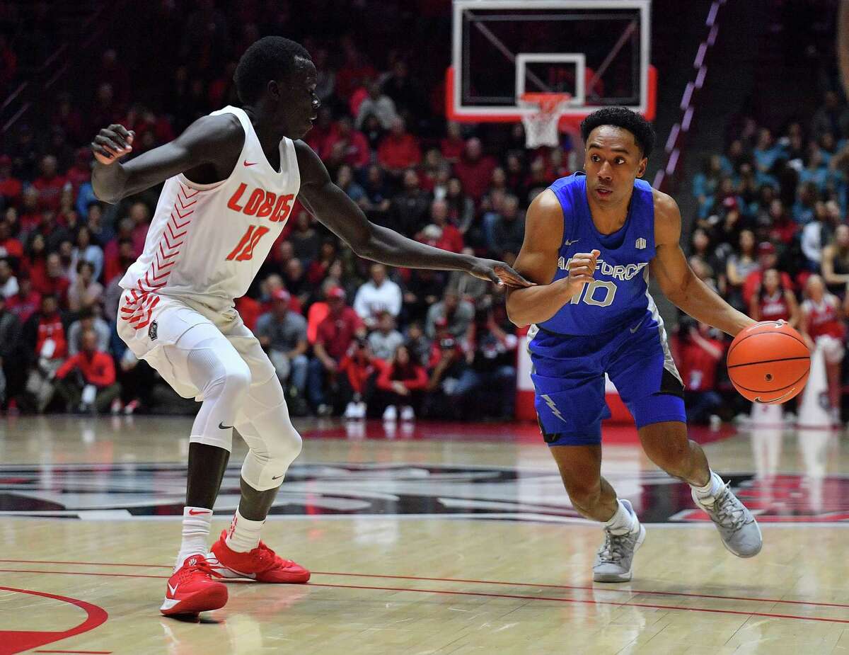 ALBUQUERQUE, NEW MEXICO - JANUARY 11: A.J. Walker #10 of the Air Force Falcons dribbles against Makuach Maluach #10 of the New Mexico Lobos during their game at Dreamstyle Arena - The Pit on January 11, 2020 in Albuquerque, New Mexico. (Photo by Sam Wasson/Getty Images)