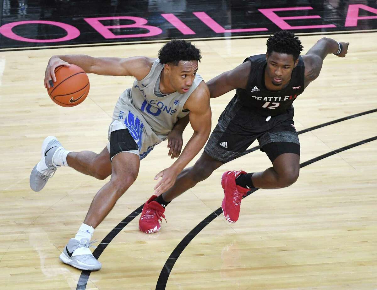 Air Force junior point guard A.J. Walker, left, a Saint Mary’s Hall graduate, leads the Falcons with 15.3 points per game. The Falcons are 4-16 this season and might not be competitive yet, but coach Joe Scott said Walker is part of the team’s rebuilding.