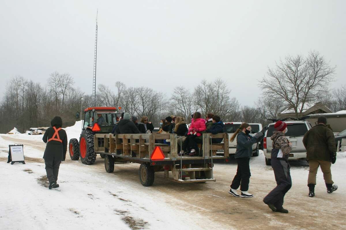 Cars of visitors lined up at the entrance to CranHill ranch to take advantage of a day of winter fun at Winterfest Part II on Sunday. Visitors spent the day ice skating, ice climbing, sledding and playing broomball.
