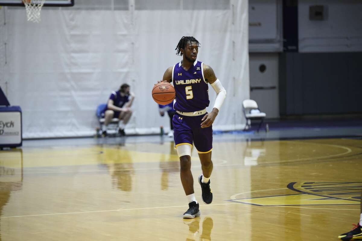 UAlbany point guard Jamel Horton brings the ball upcourt against Stony Brook in an America East basketball game Sunday, Feb. 21, 2021, at SEFCU Arena in Albany. Horton had 10 points and two assists in UAlbany's 67-59 victory. (Kathleen Helman/UAlbany athletics)