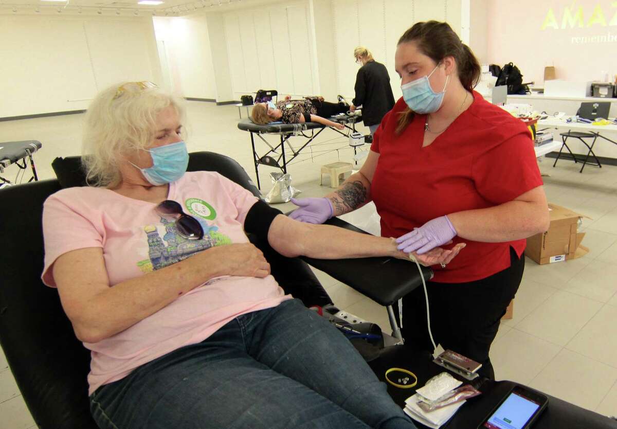 A file photo of an American Red Cross blood drive at the mall in Milford, Conn., on Tuesday July 28, 2020. After recent winter weather in Connecticut prompted the Red Cross to cancel appointments for blood donations, officials are urging those able to donate to do so immediately.