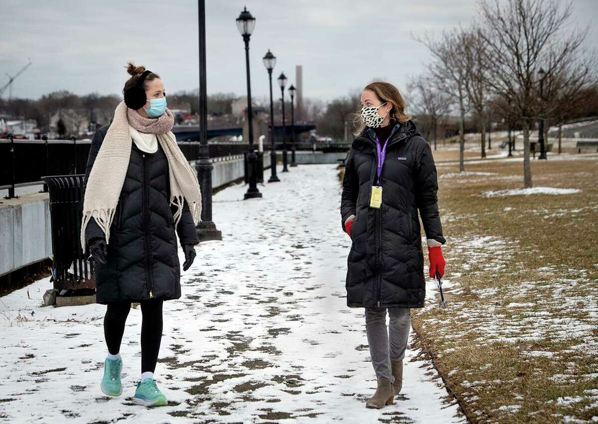 Meghan Casey, left, a nursing and public health student at Yale, and Amanda E. DeCew, an advanced practice registered nurse in pediatrics at Fair Haven Community Health Care in New Haven, go for a lunchtime walk along Quinnipiac River Trail on Front Street. DeCew, also the clinic’s director for quality improvement and risk management, became interested in the benefits of nature therapy after hearing a podcast on the topic. She, and a few other colleagues, now prescribe outdoor activities to children and adults when they think it’s appropriate.
