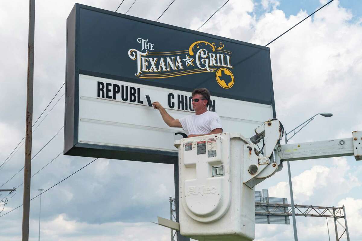 After installing the new sign for The Texana Grill, Cody Teems of Image 360 Beaumont removes the lettering on the former Republic Chicken sign. By next week, the eatery on Interstate 10 near Beaumont???s hotel corridor will be transforming to The Texana Grill. Photo made on August 5, 2020. Fran Ruchalski/The Enterprise