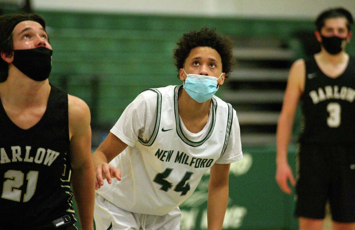 New Milford’s JoJo Wallace, son of former Knick John Wallace, get ready to rebound against Joel Barlow on Feb. 13 in New Milford.