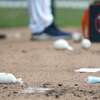 A discarded mask lies next to a baseball and rosin bag during a bullpen session during the first full squad workouts for the Astros, in West Palm Beach, Florida, Monday, February 22, 2021.