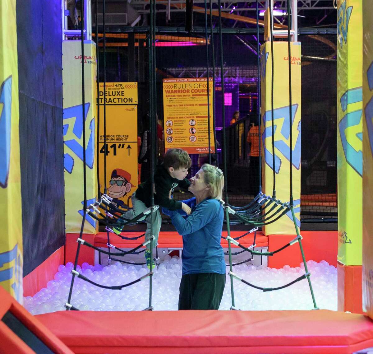 Lynn Engert helps her grandson Jack Shannon through an American Ninja Warrior inspired obstacle course in the U.S. during a previous year at Urban Air is a full-service family entertainment center that offers a variety of attractions for all ages, and fitness levels. The Ridgefield Parks & Recreation department in Ridgefield, Conn., is offering a new Outdoor Ninja Warrior program for children in kindergarten through sixth grade starting April 21.