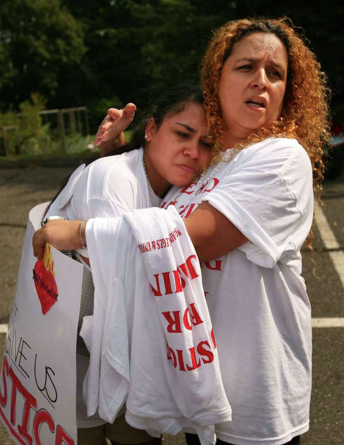 2010 Sacred Heart University graduate Jasmine Vega, left, is comforted by her mother Jacqueline Rossy-Vega, both of Bronx, NY, at a rally for Jasmine's cause outside Sacred Heart University in Fairfield on Tuesday, September 7, 2010. Vega was injured in a sorority hazing incident on October 2, 2009.