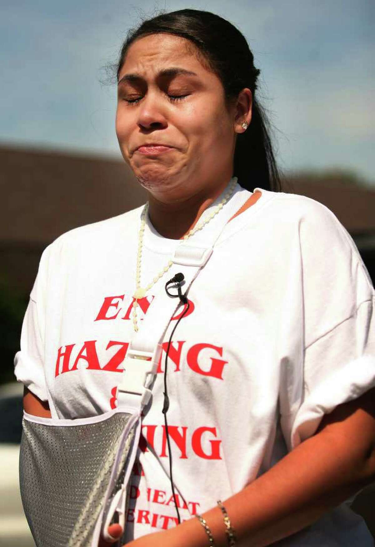 2010 Sacred Heart University graduate Jasmine Vega of Bronx, NY cries as she discusses her injuries at a rally outside Sacred Heart University in Fairfield on Tuesday, September 7, 2010. Vega claims that a torn ligament in her shoulder as well as a severe sprain and pinched nerve in her leg are the result of a sorority hazing incident on October 2, 2009.