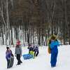 Children play on the sledding hill at City Forest Monday afternoon, Feb. 22, 2021 in Midland. Midland Public Schools and several other local school districts closed on Monday due to inclement weather. (Katy Kildee/kkildee@mdn.net)