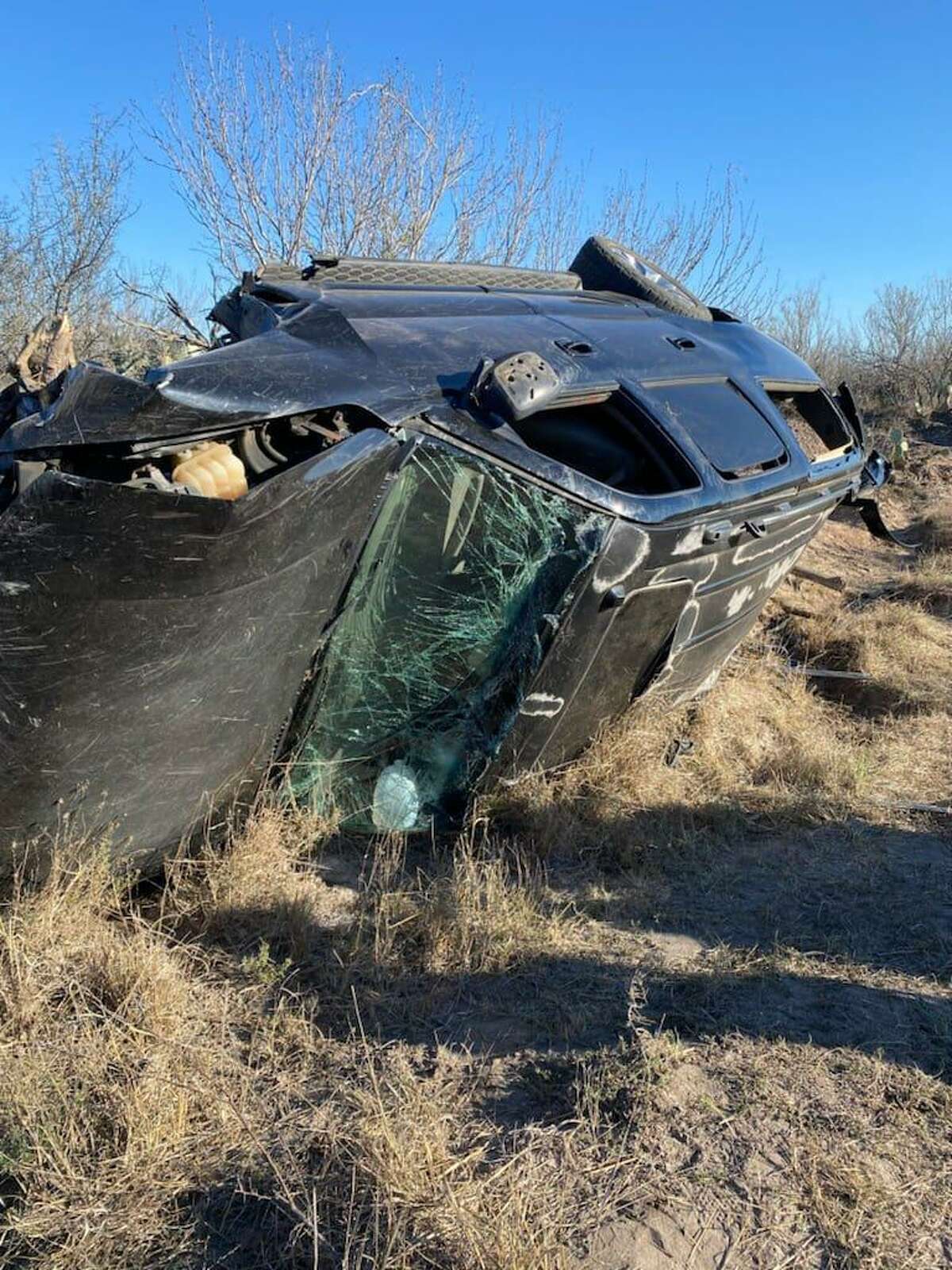 The Texas Department of Public Safety said the driver of this vehicle was transporting multiple immigrants before rolling over and crashing into a ranch fence.