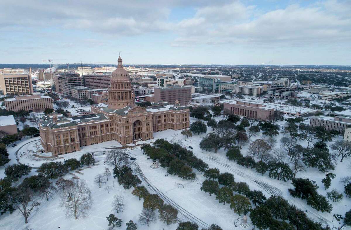 The Texas Capitol grounds are covered in snow on Monday, February 15, 2021. (Jay Janner/Austin American-Statesman/TNS)