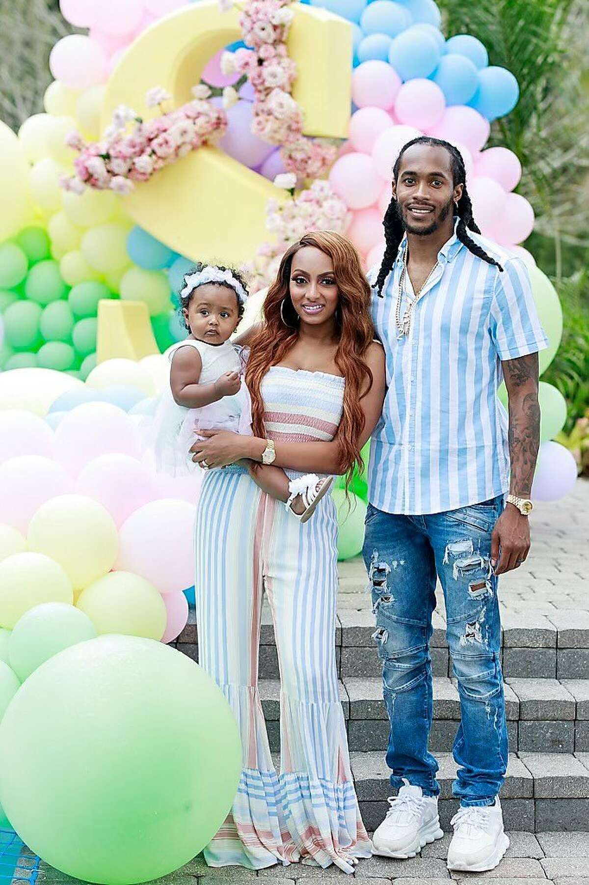 Travis Benjamin with his wife, Africa, and daughter, Semai. Benjamin was one of 69 players to opt out of the NFL season.