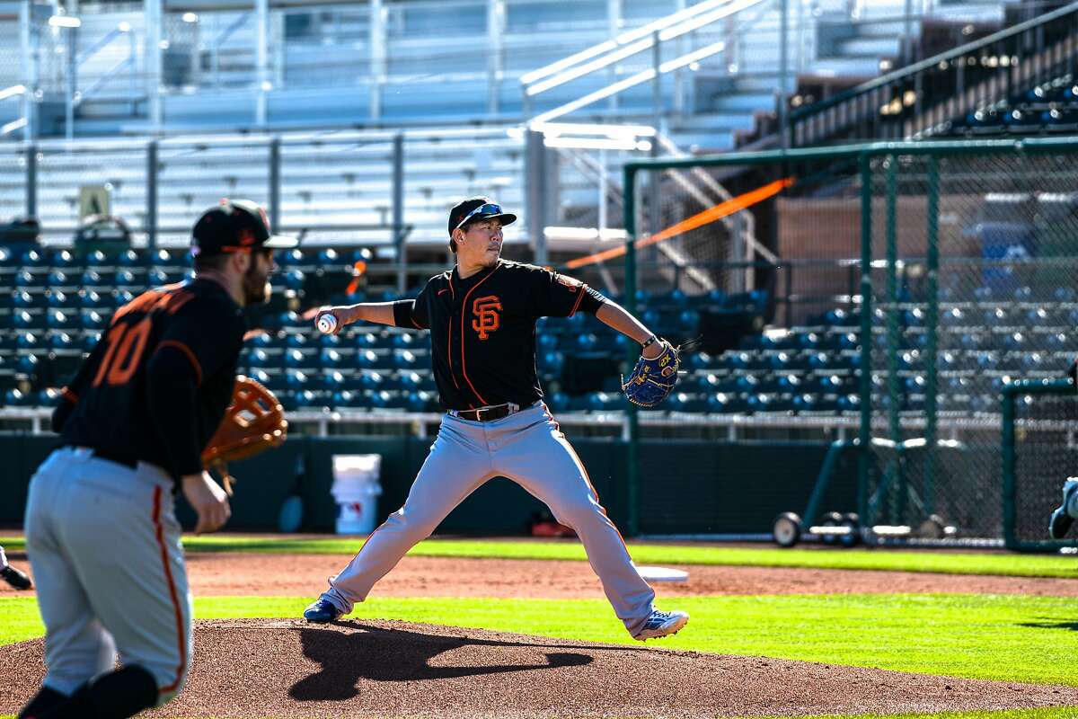 Shun Yamaguchi works through some bunt options during a practice at Scottsdale Stadium in Arizona. Yamaguchi was a star in 2019 for the Yomiuri Giants, as he went 16-4 with a 2.78 ERA.