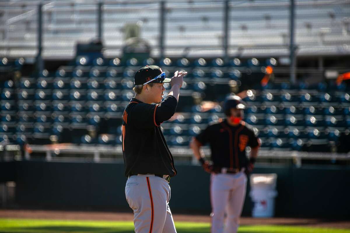 Newest signing, pitcher Shun Yamaguchi 77 works through some bunt options San Francisco Giants practice at Scottsdale stadium before opening day of Spring Training in the Cactus League, on Monday, Feb. 22, 2021, in Scottsdale, Ariz..