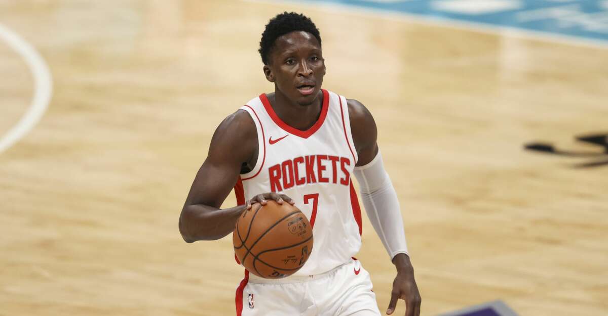 Houston Rockets guard Victor Oladipo (7) brings the ball up court against the Charlotte Hornets in the first half of an NBA basketball game in Charlotte, N.C., Monday, Feb. 8, 2021. (AP Photo/Nell Redmond)