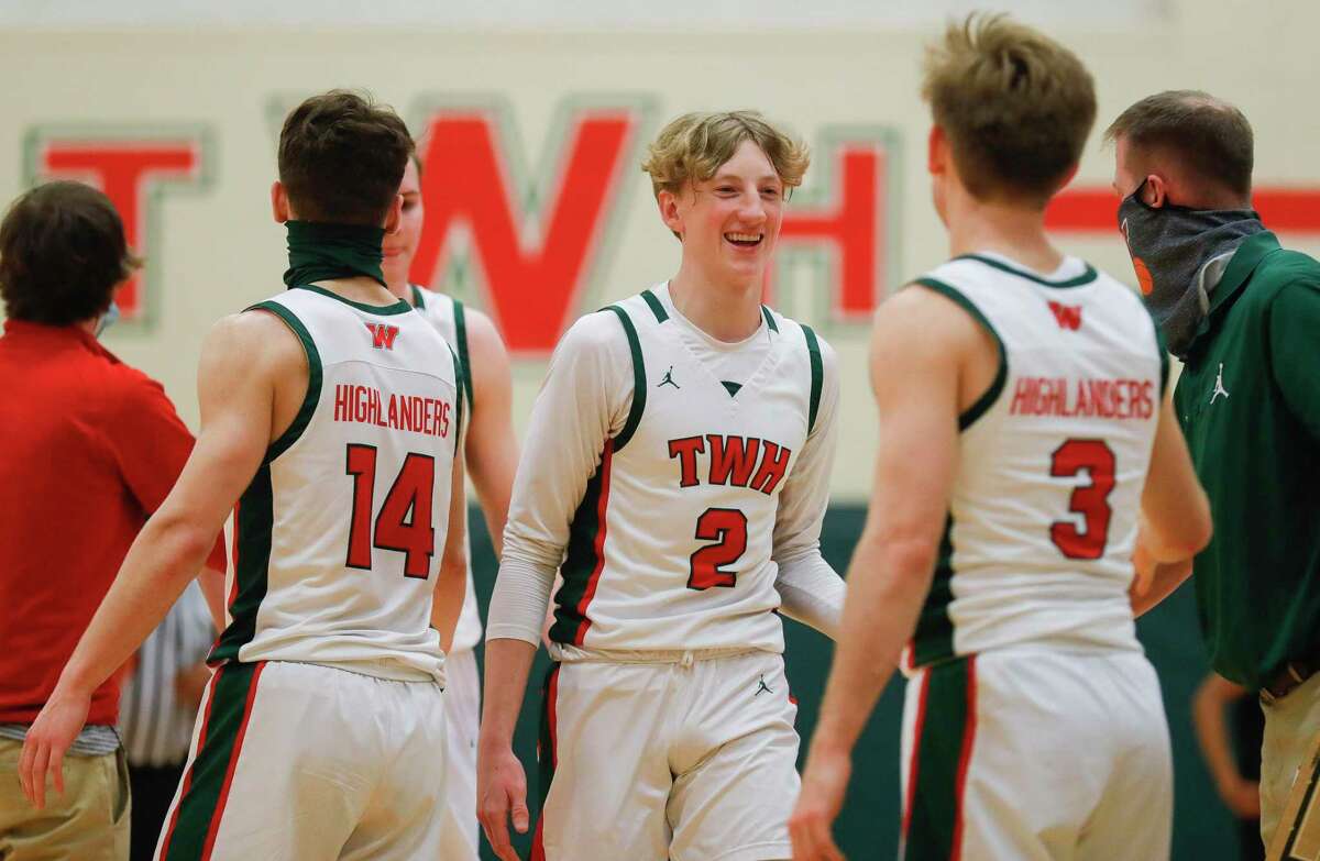 FILE — The Woodlands guard Shey Eberwein (2) smiles as he comes in for halftime with a 20-point lead earlier this season.