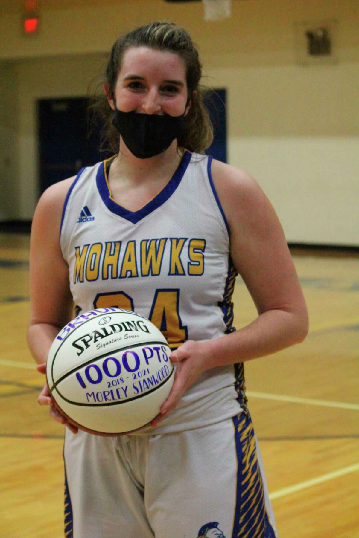 Morley Stanwood's Brooke Brauher was presented with a ball for hitting the 1,000-point total on Monday. (Pioneer photo/John Raffel)