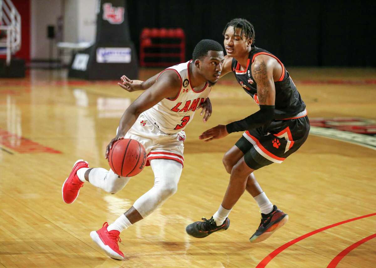 Lamar guard Ellis Jefferson drives past a Sam Houston defender during the Cardinals' loss Monday night at the Montagne Center