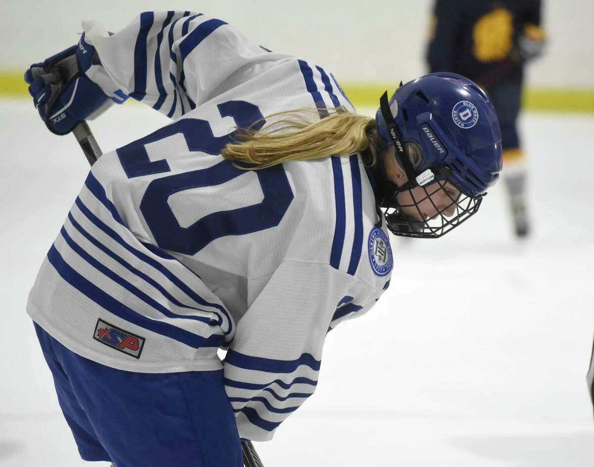 Darien's Nelle Kniffin (20) awaits a puck drop during a girls ice hockey game against Simsbury at the Darien Ice House on Tuesday, Jan. 28, 2020.