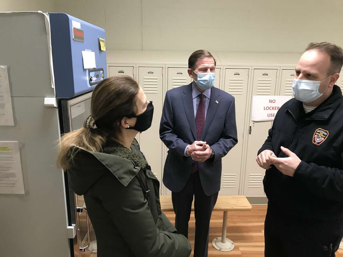 Adam Rinko, right, emergency management director for the city of Waterbury, shows the vaccine storage room to Lt. Gov. Susan Bysiewicz and Sen. Richard Blumenthal on Feb. 19, 2021, at a vaccination clinic at a magnet school run by the city and St. Mary's Hospital.