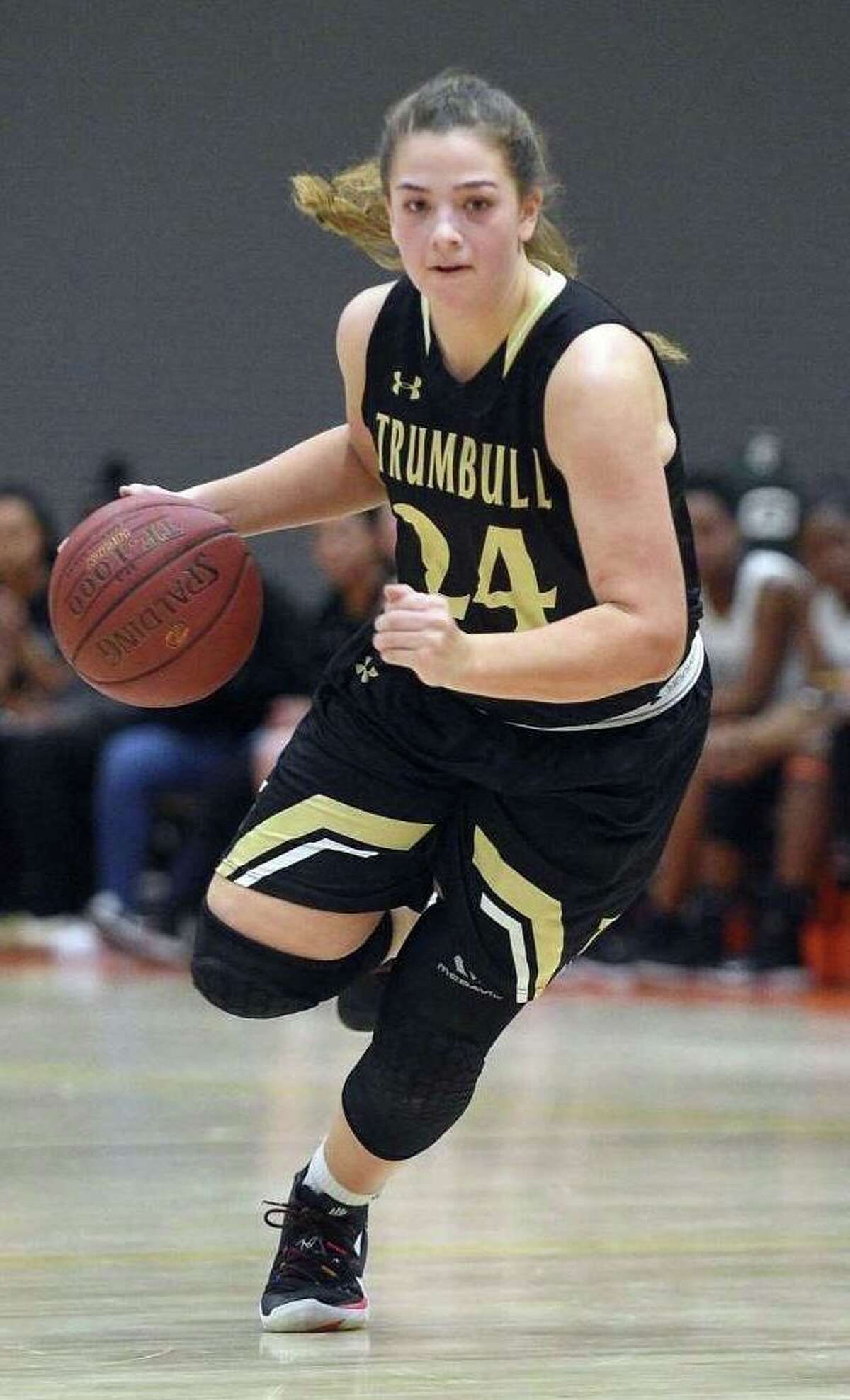 Cassi Barbato brings the ball up for Trumbull during its game against Stamford.