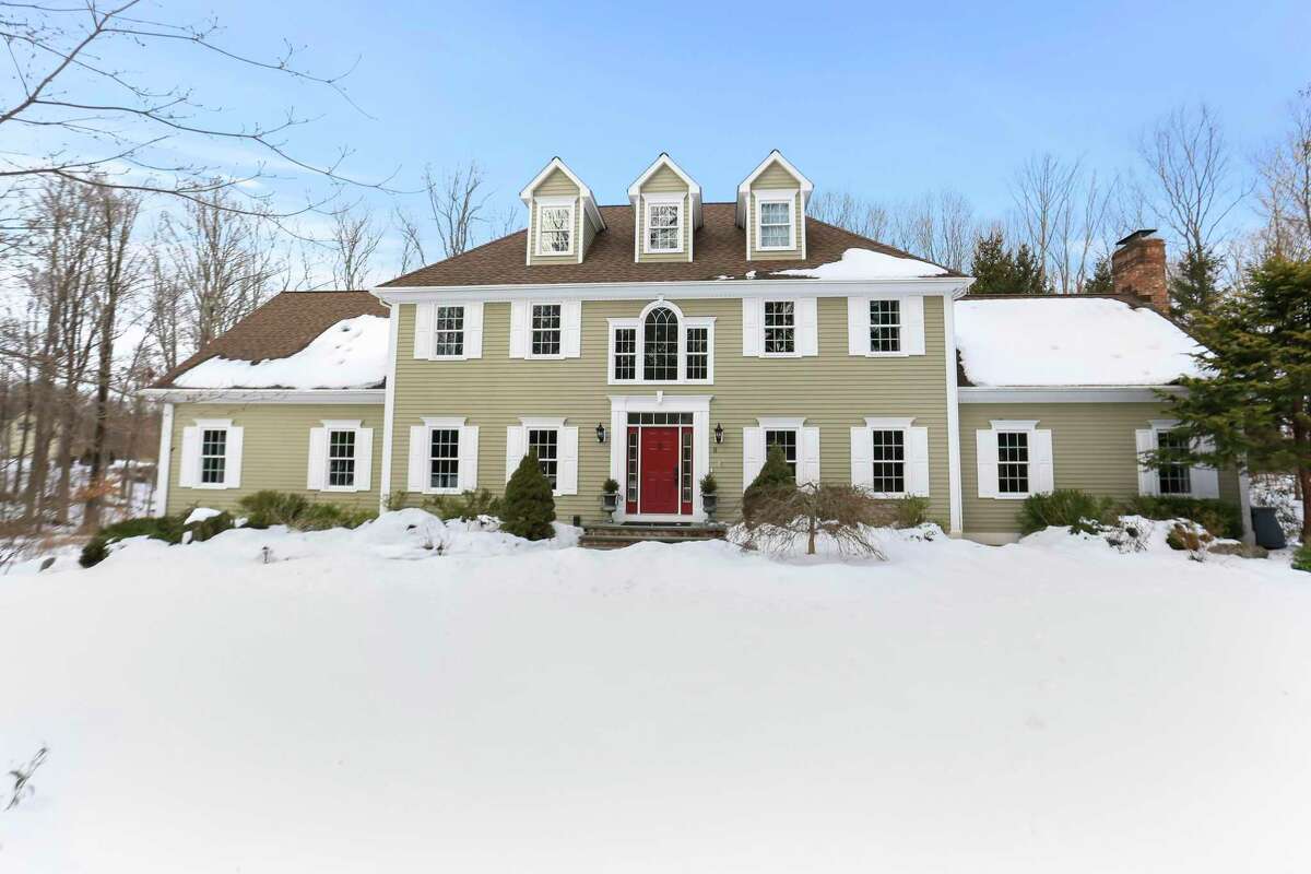 Taupe-colored colonial at 8 Canterbury Lane, Easton.