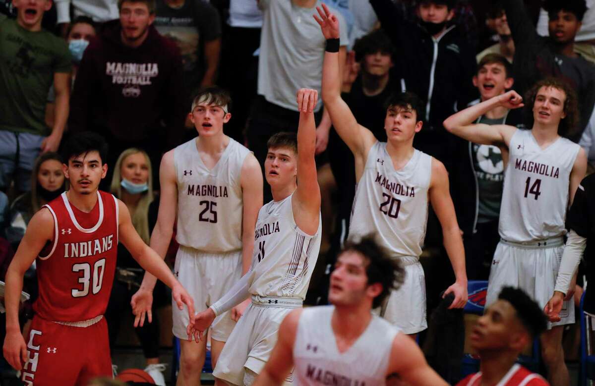 Magnolia shooting guard Connor Lindvall (11) hits a 3-pointer at the buzzer to end the third quarter of a Region III-5A area bi-district basketball playoff game at Oak Ridge High School, Saturday, Feb. 20, 2021.