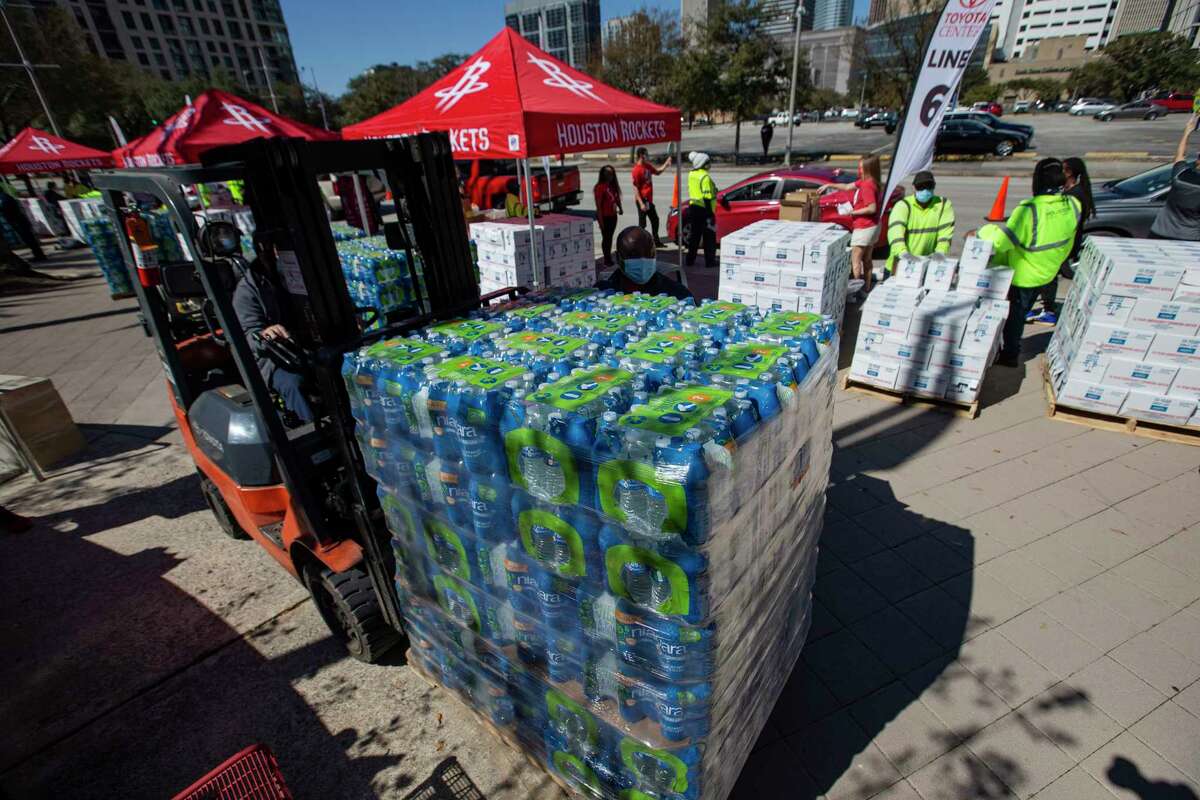 City of Houston partners with Houston Rockets to distribute bottled water to people in need Tuesday, Feb. 23, 2021, at Toyota Center in Houston.