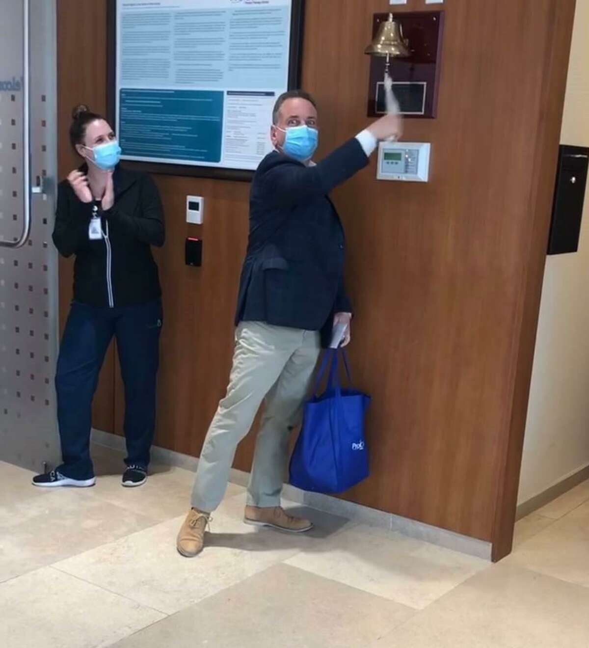John Coppola of West Haven rings a bell at the conclusion of a round of cancer treatment.