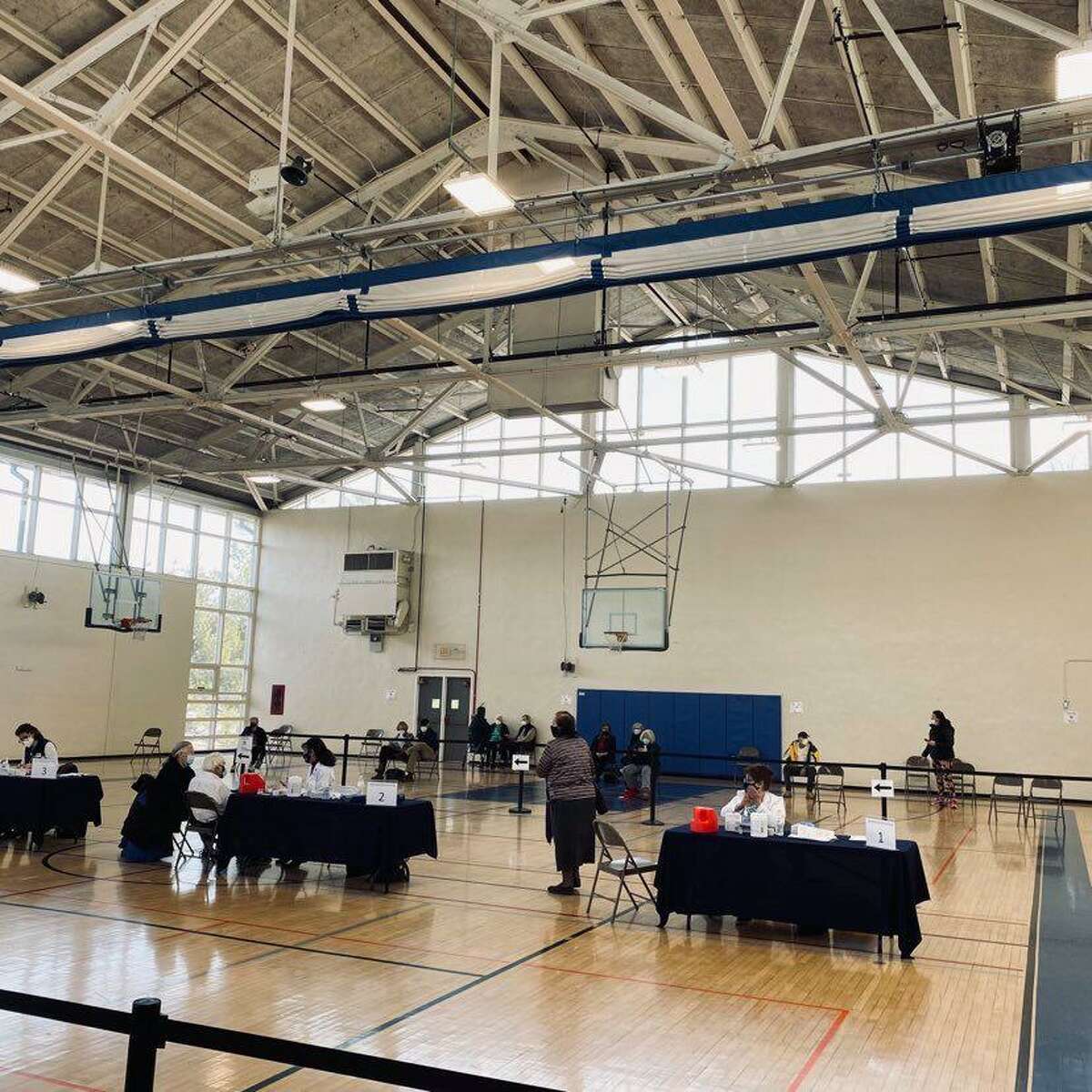 Darien teachers and school employees will begin receiving the vaccine next week at the Mather Community Center gymnasium where the clinic is currently set up.