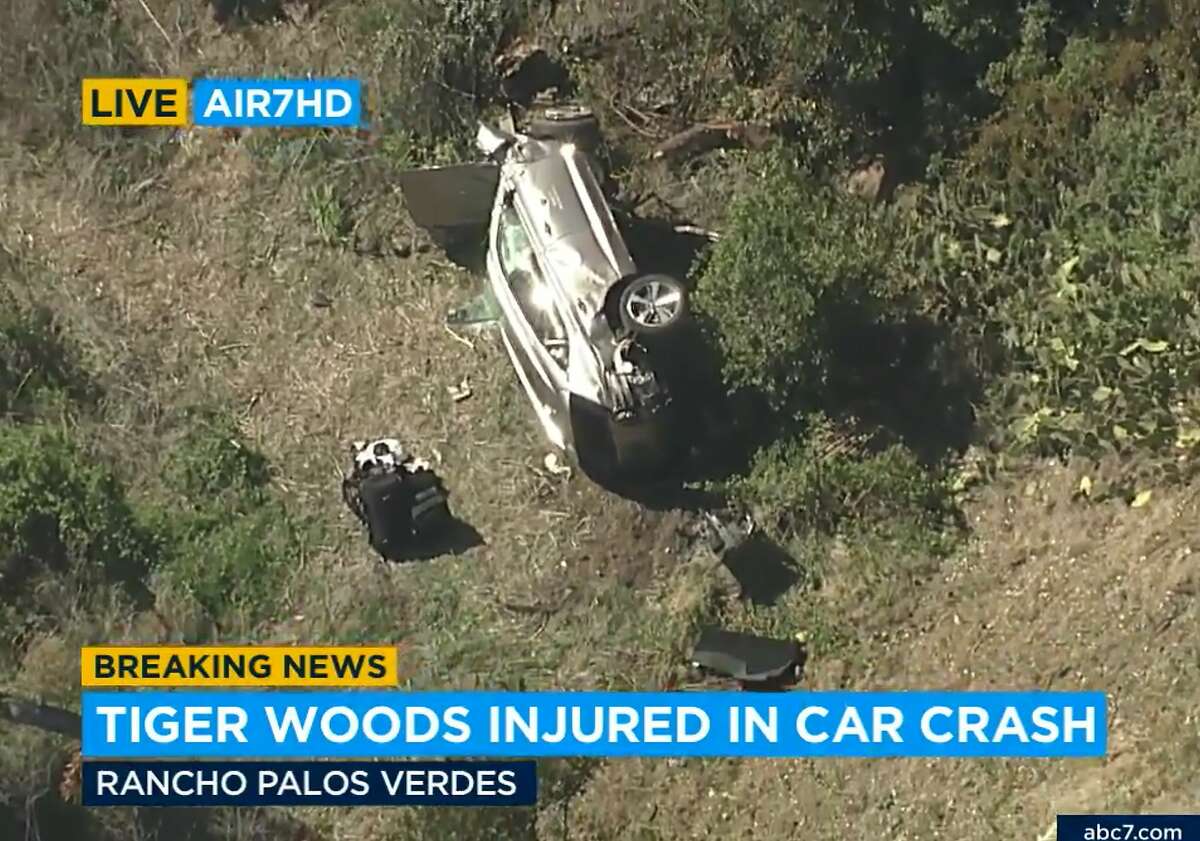 In this aerial image take from video provided by KABC-TV video, a vehicle rest on its side after a rollover accident involving golfer Tiger Woods along a road in the Rancho Palos Verdes section of Los Angeles on Tuesday, Feb. 23, 2021. Woods had to be extricated from the vehicle with the