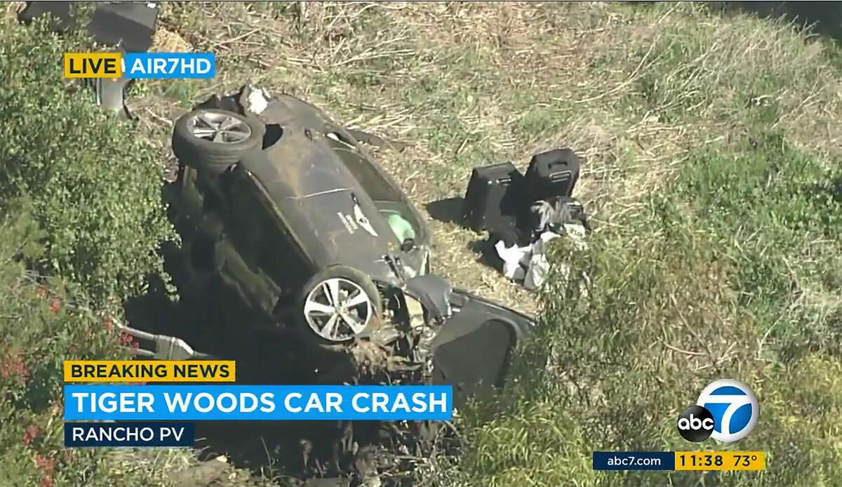 In this an aerial image take from video provided by KABC-TV video, a vehicle rest on it's side after rollover involving golfer Tiger Woods along a road in the Rancho Palos Verdes section of Los Angeles on Tuesday, Feb. 23, 2021. Woods had to be extricated from the vehicle with the