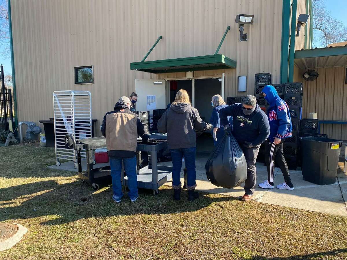 Meals on Wheels Montgomery County volunteers clean out fridges and freezers after a winter storm spoiled $15,000 in food items for senior citizens.