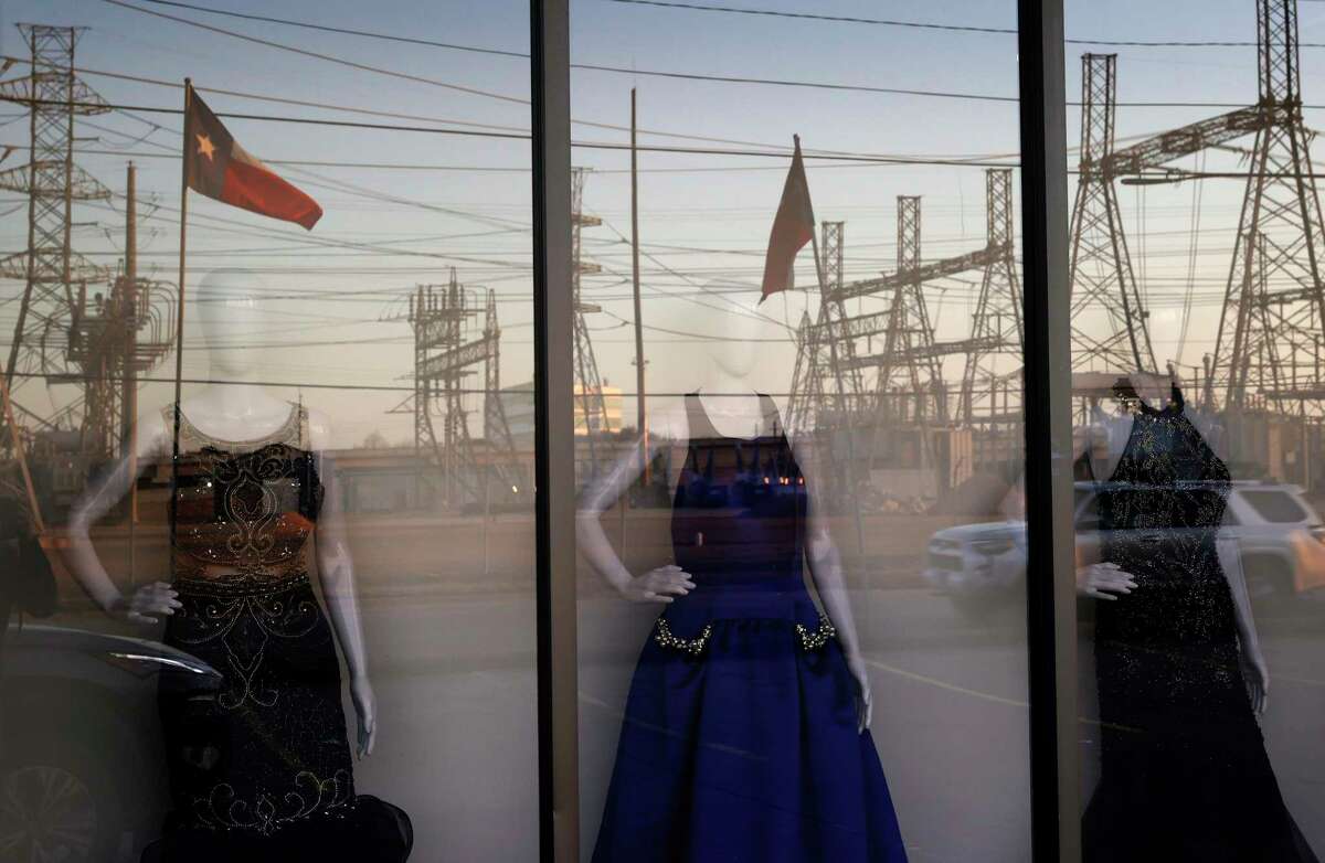 HOUSTON, TEXAS - FEBRUARY 21: An electrical substation is reflected in the window of a dress shop on February 21, 2021 in Houston, Texas. Millions of Texans lost their power when winter storm Uri hit the state and knocked out coal, natural gas and nuclear plants that were unprepared for the freezing temperatures brought on by the storm. Wind turbines that provide an estimated 24 percent of energy to the state became inoperable when they froze. (Photo by Justin Sullivan/Getty Images)