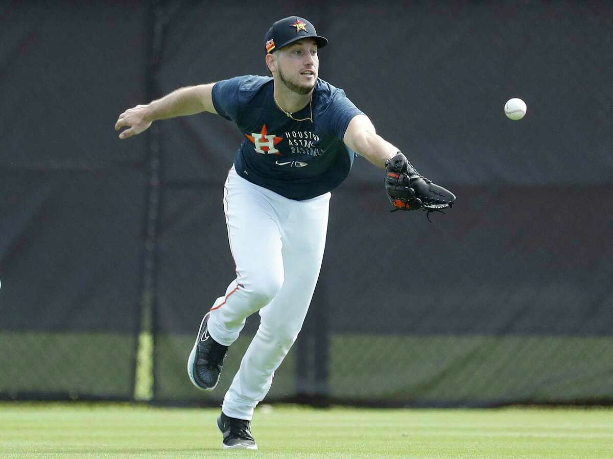Outfielder Kyle Tucker keeps his eye on the ball during the Astros’ second day of full-squad workouts Tuesday at West Palm Beach, Fla.