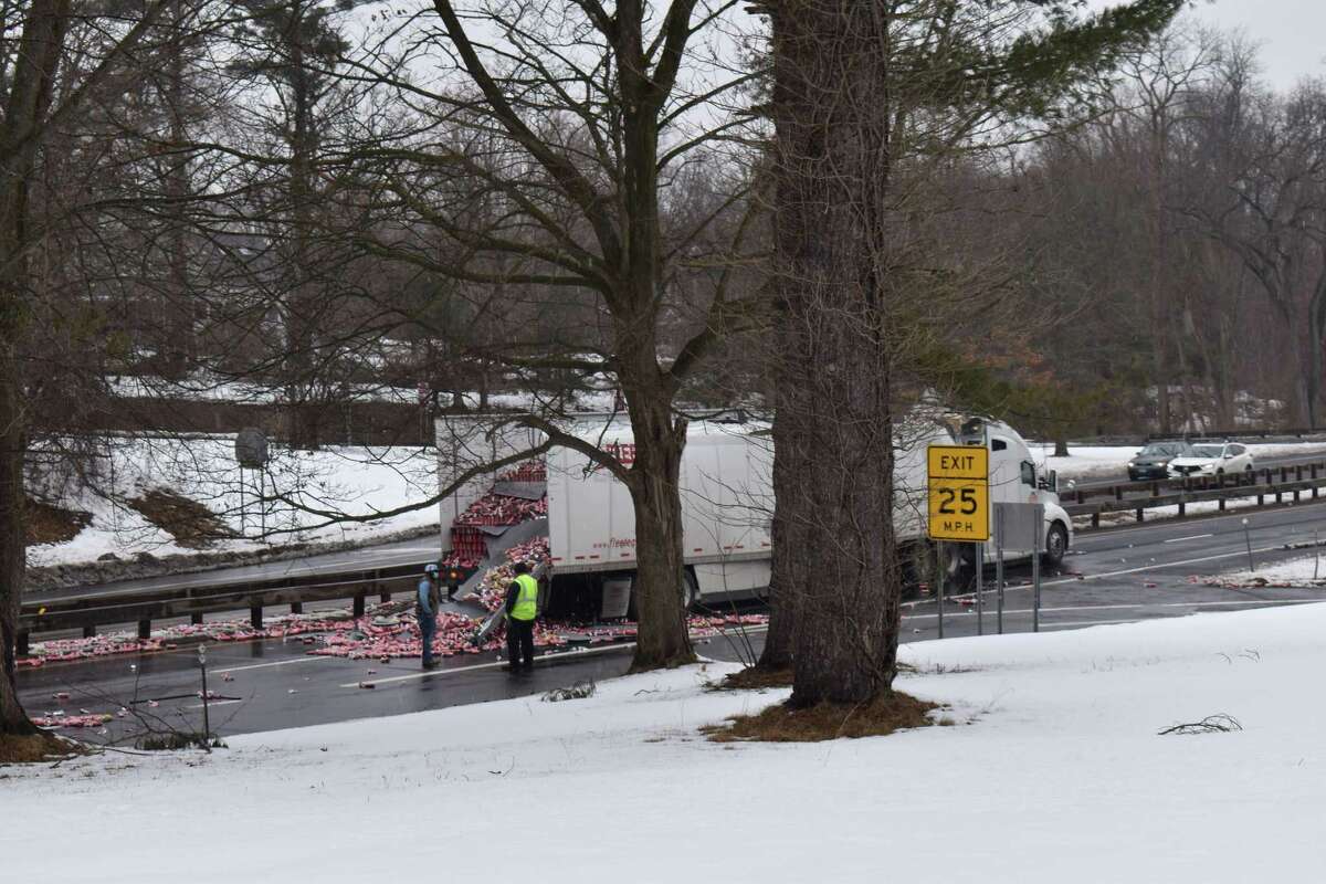 A truck hit a bridge on the Hutchinson River Parkway, spilling its load of energy drink onto the roadway on Tuesday morning.