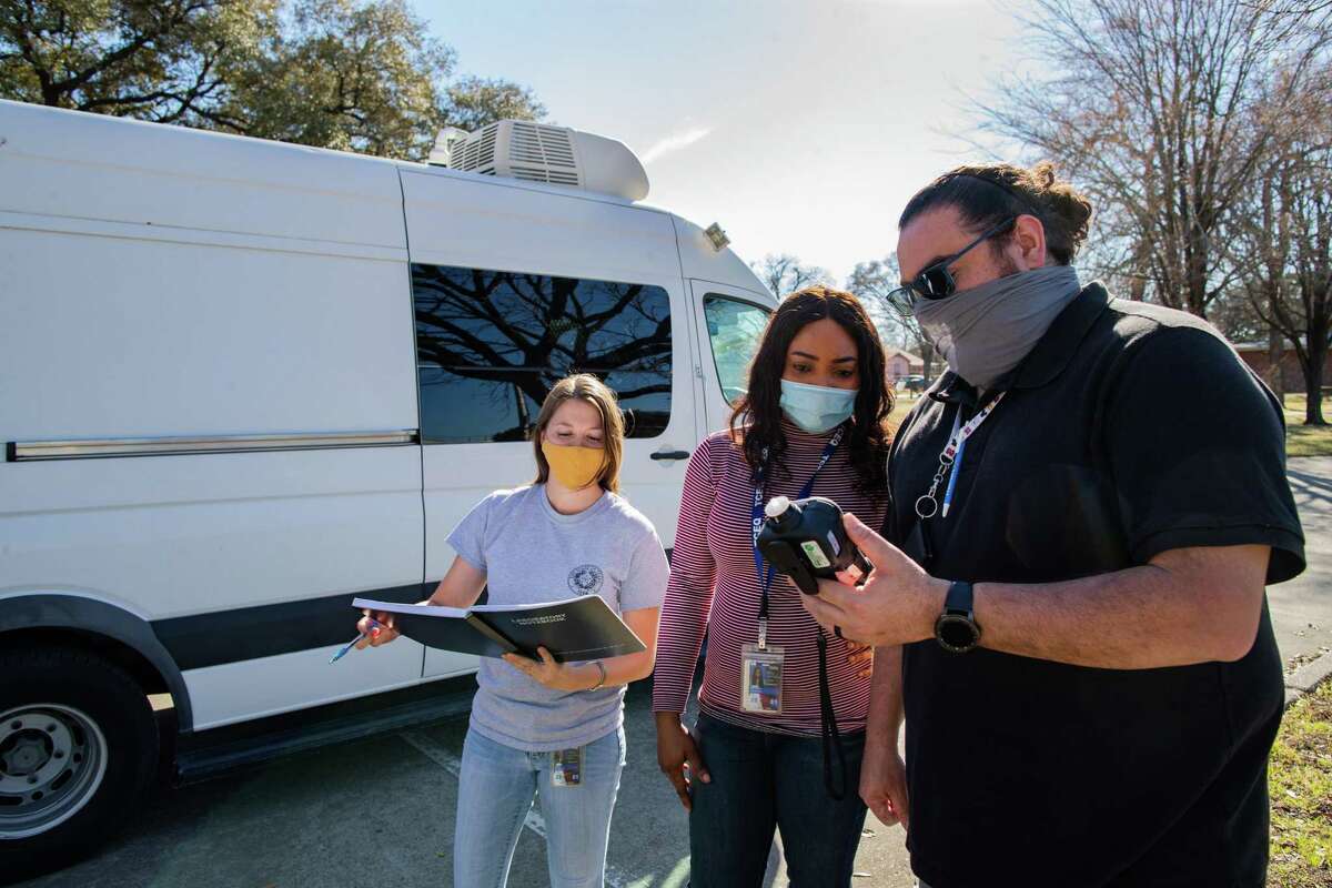 Texas Commission on Environmental Quality investigators Natalie Izral, Uchechi Nwaiwu and Sam Cortez conduct handheld air monitoring surveys in the Manchester community of Houston.