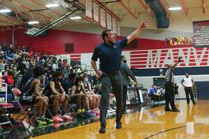 Dawson basketball coach Mark Barre reacts to play on the court against Dickinson Tuesday at Manvel High School.