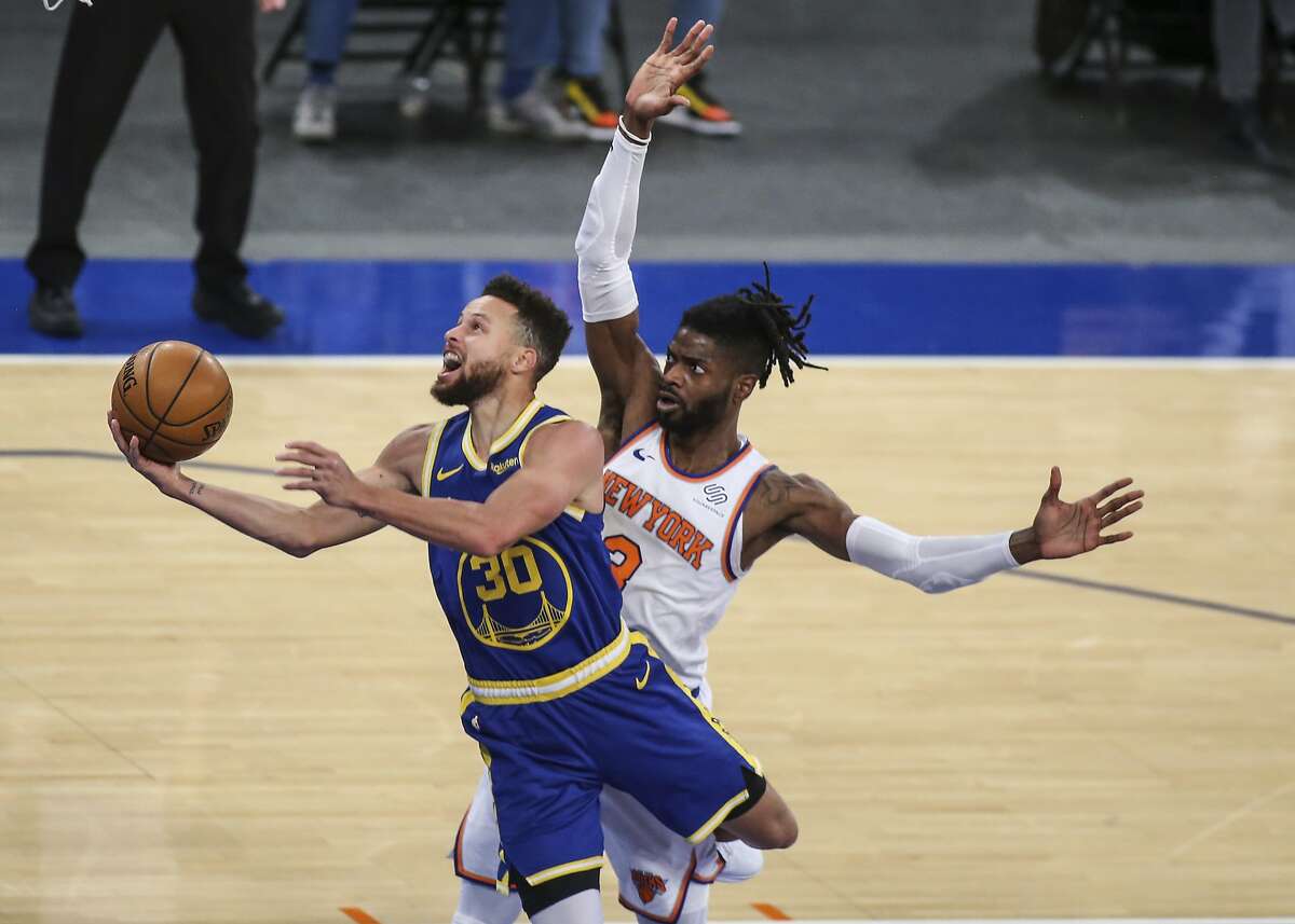 Golden State Warriors guard Stephen Curry (30) moves past New York Knicks center Nerlens Noel (3) during the first quarter of an NBA basketball game Tuesday, Feb. 23, 2021, in New York. (Wendell Cruz/Pool Photo via AP)