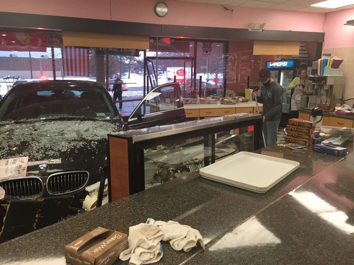 Car drives through cake case at Clifton Park bakery