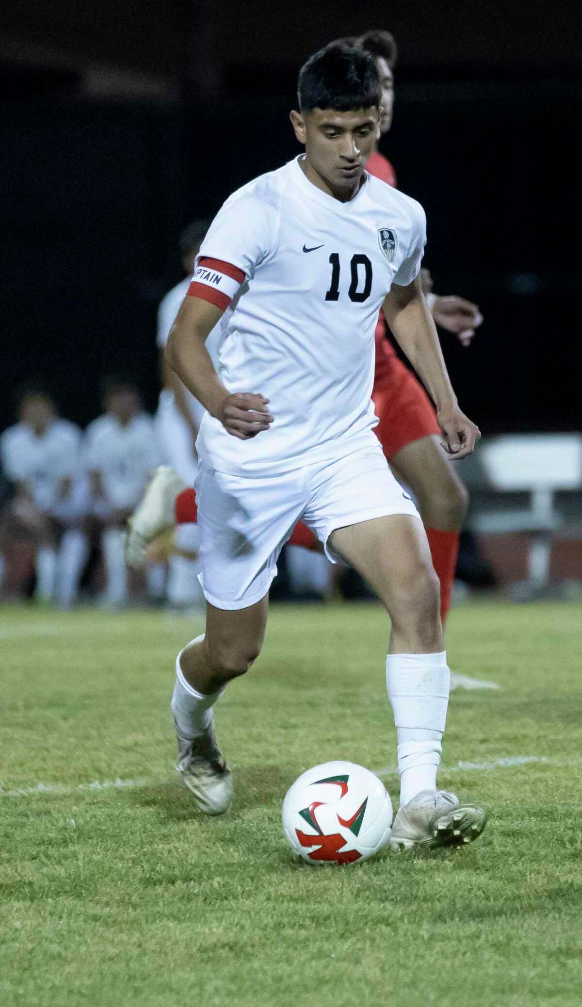 Conroe Daniel Ruiz (10) drives te ball during the first half of a District 13-6A boys soccer against The Woodlands at The Woodlands High School, Tuesday, Feb. 23, 2021, in The Woodlands.