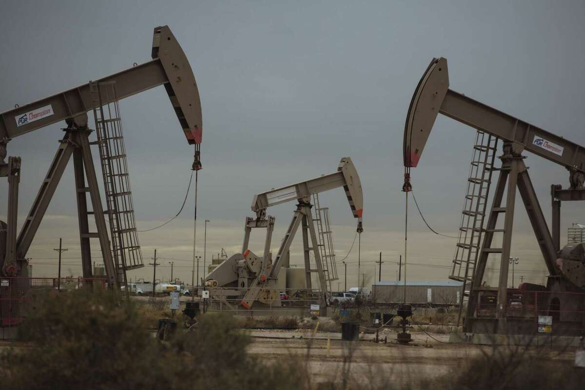 Pump Jacks extract crude oil from oil wells in Midland, Texas, on Dec. 17, 2018.